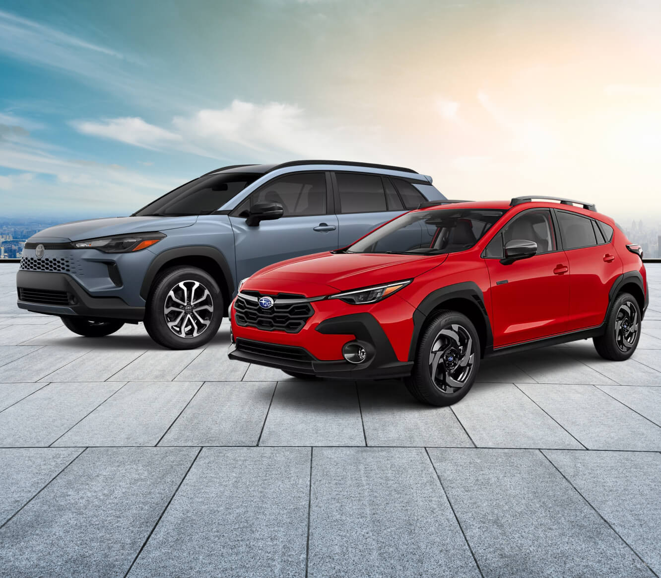 Front-three-quarter view comparing a Toyota Corolla Cross Hybrid SE in Celestite with a Subaru Crosstrek Limited Hybrid in Pure Red.