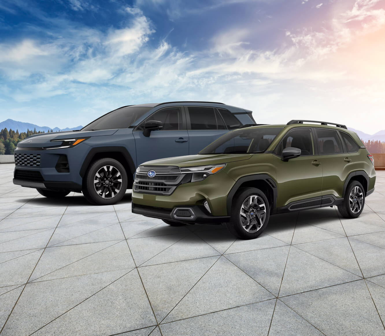 Front-three-quarter view comparing a Toyota RAV4 Limited in Storm Cloud with a Subaru Forester Touring Hybrid in Autumn Green Metallic.