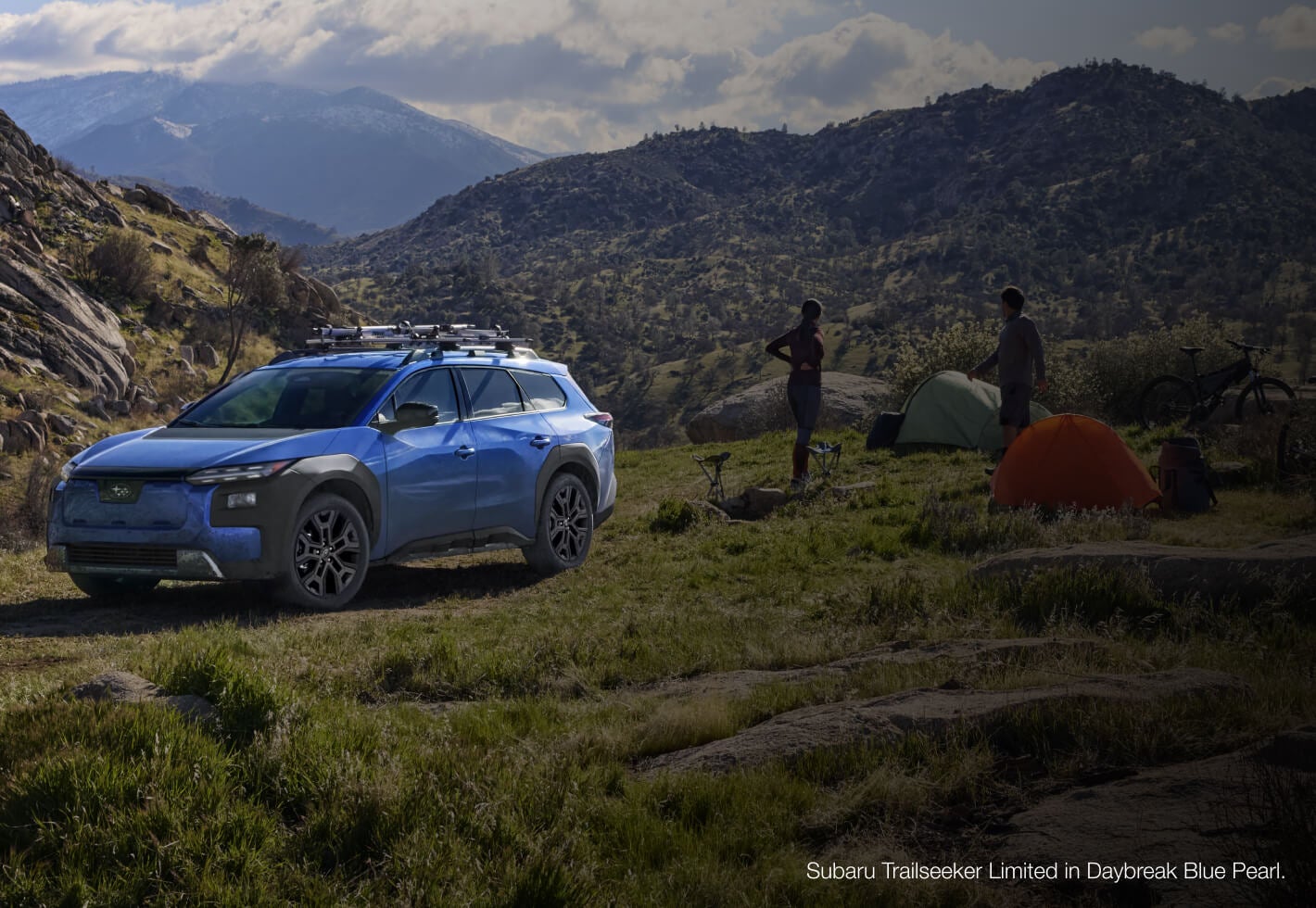 Front-three-quarter view of a Subaru Trailseeker Limited in Daybreak Blue Pearl equipped with a roof rack.